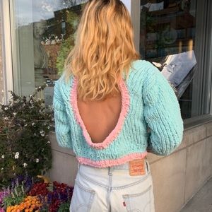Handmade knit sweater with an open back